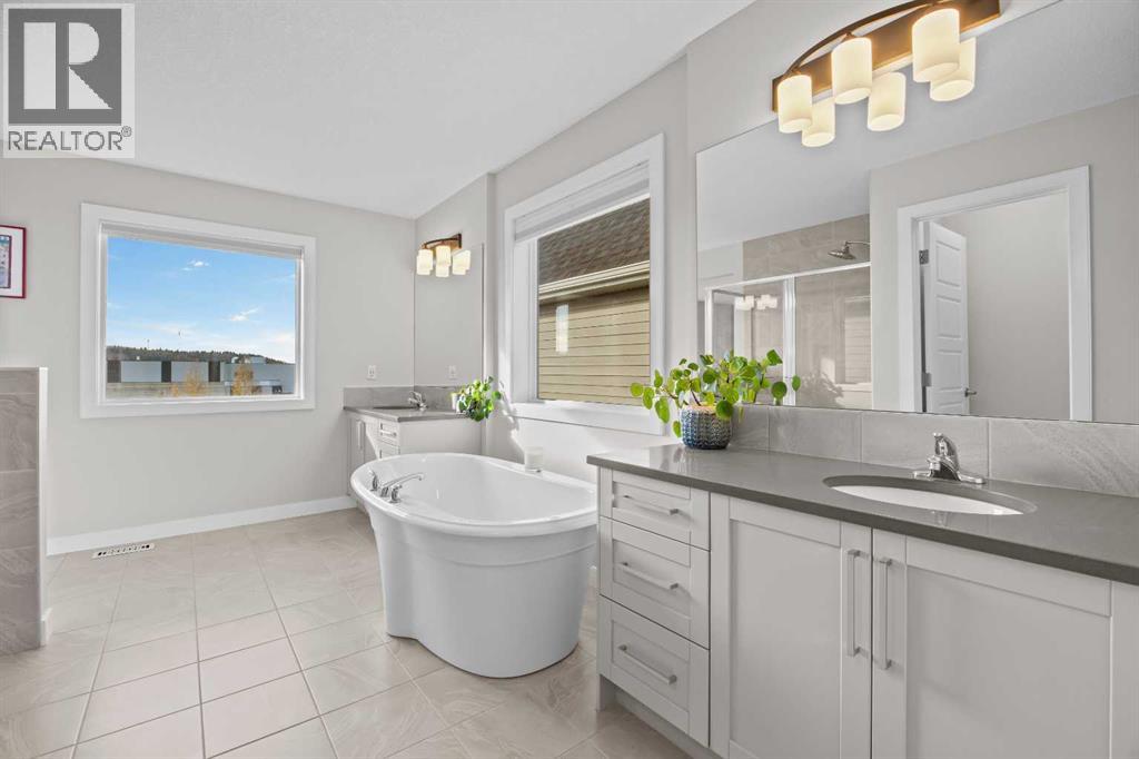 Dual vanities give everyone their own space to get ready in the morning, while the freestanding tub adds a welcome touch of relaxation