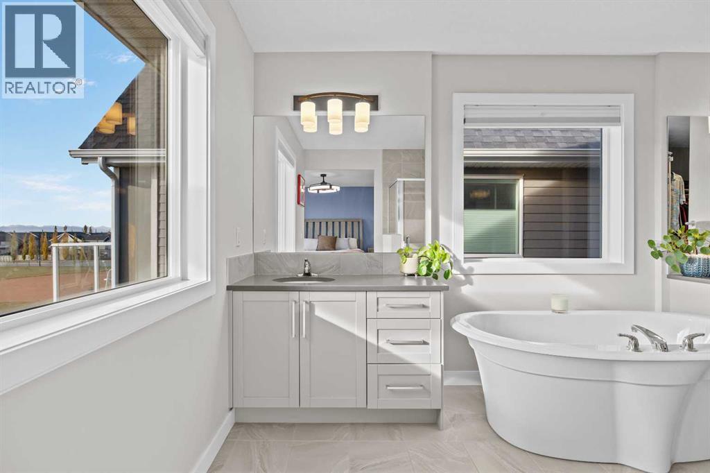 A beautiful connection between indoors and out, with natural light, lovely views, and a freestanding soaker tub that invites you to slow down