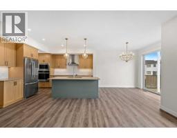 Family room - 125 Quartz Crescent, Cochrane, AB T4C3G2 Photo 9