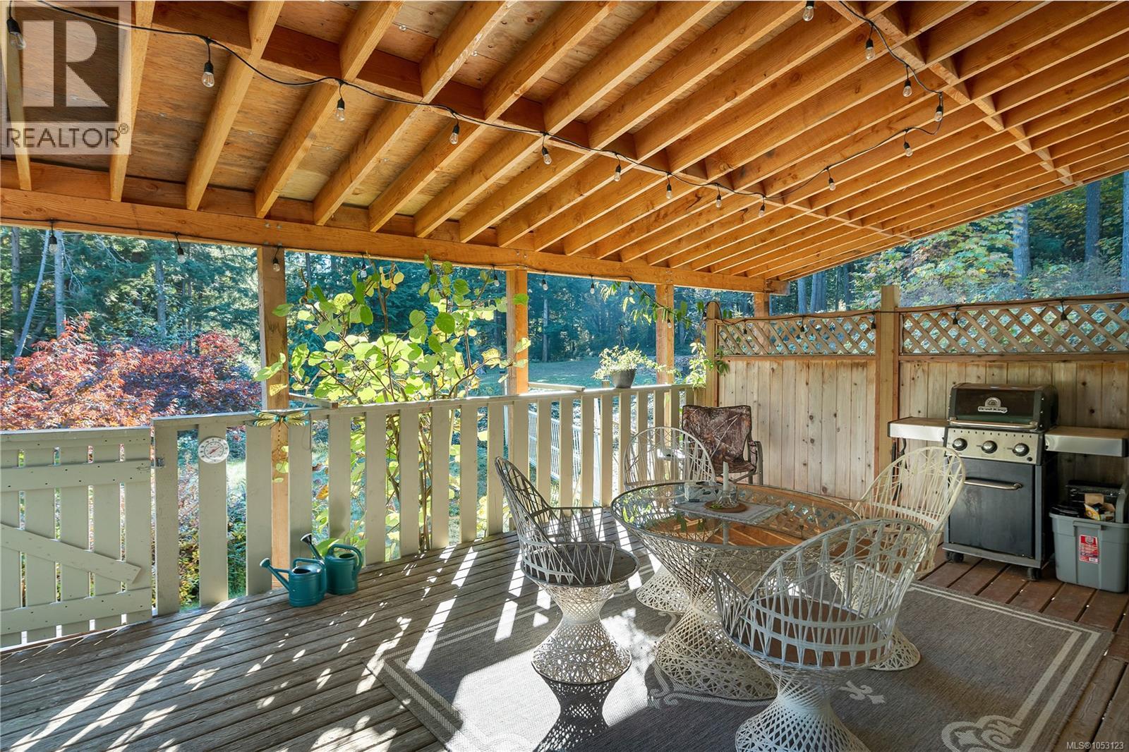 large covered deck off the kitchen, enjoy year round outdoor entertaining!