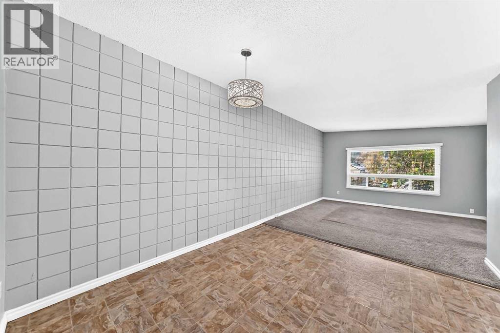 View of living room with deck from dining area (main floor)