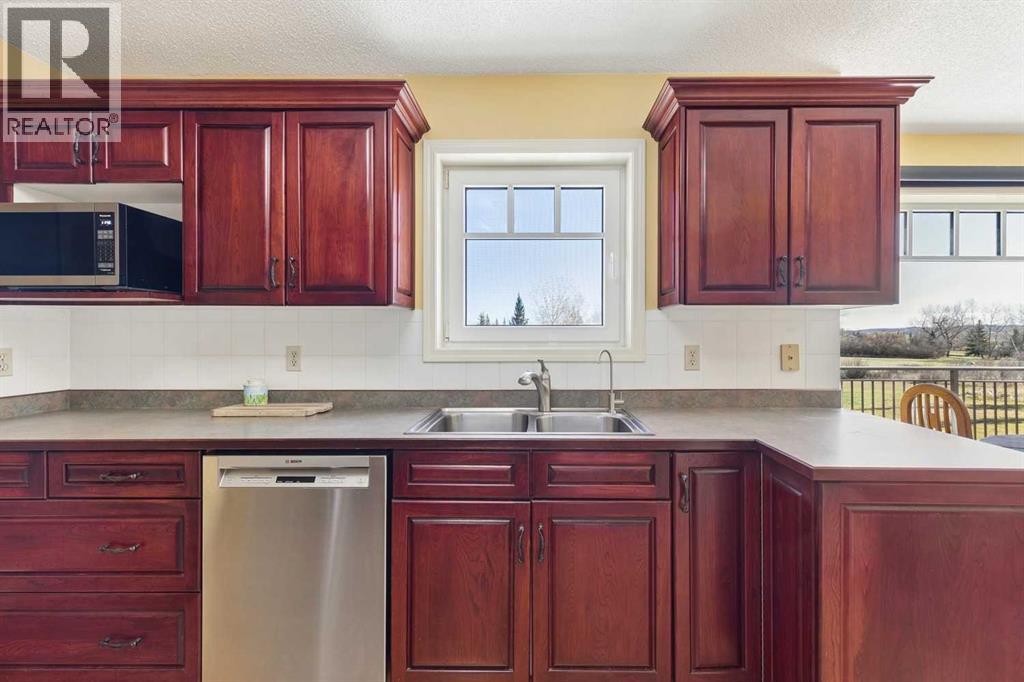 The kitchen features solid cherry cabinetry and a reverse osmosis water filtration system
