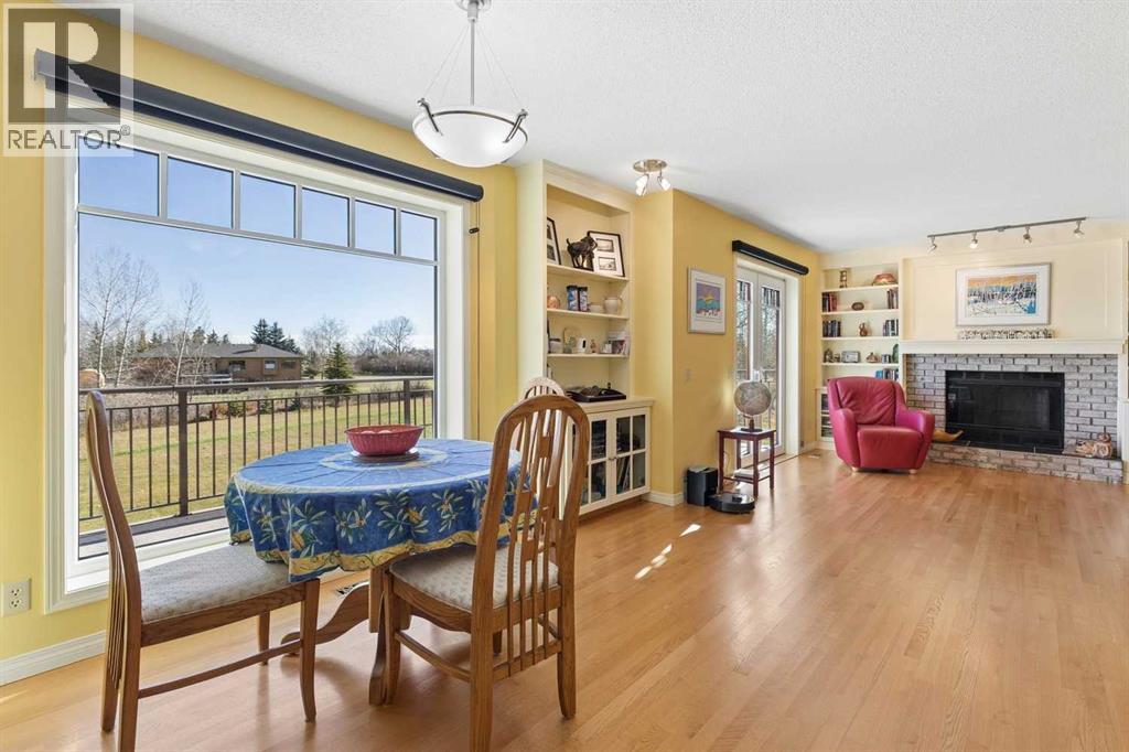Large bright windows in the breakfast nook and patio doors leading to the back deck