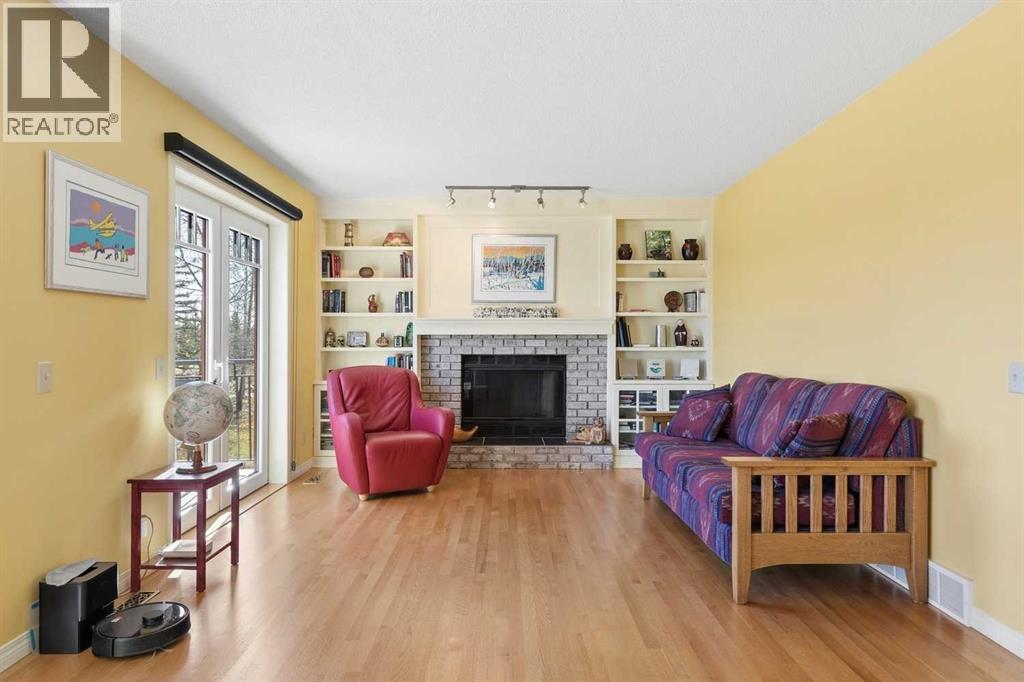 View of the family room with and double patio doors opening to the raised rear deck