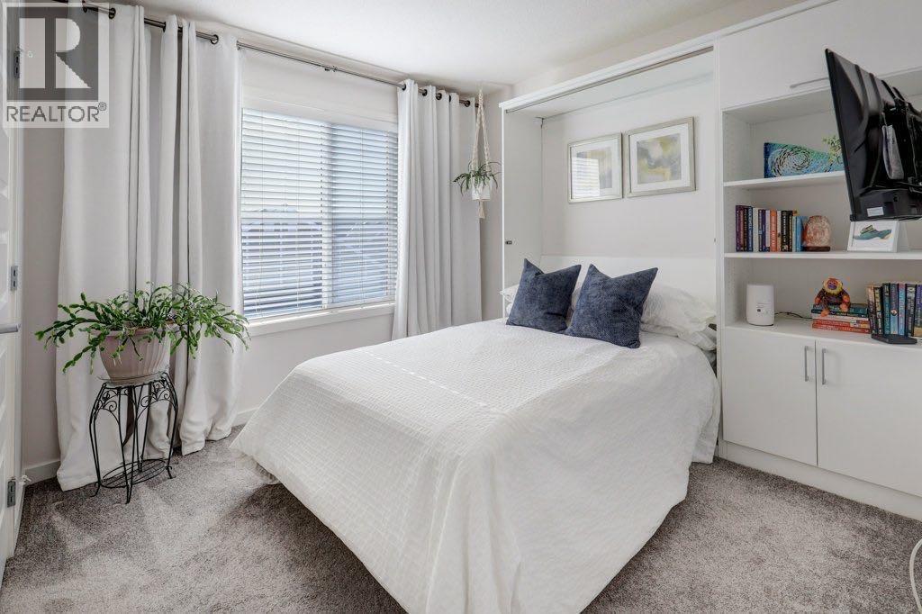 Second bedroom, has a professionally installed double sized "Murphy bed"  with storage and shelving  offering flexibility for this room