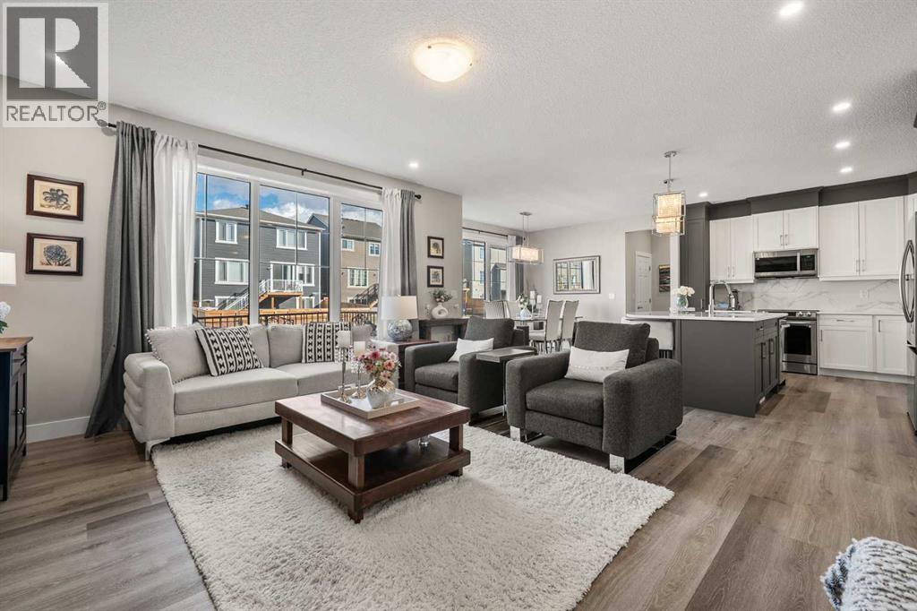 Spacious living room with comfortable seating and abundant natural light