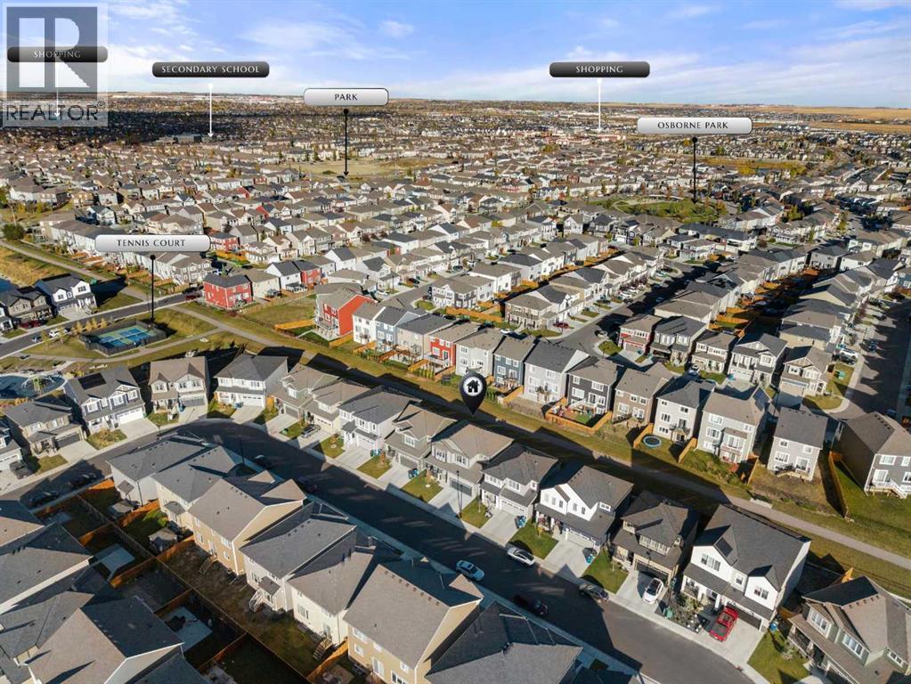 Aerial perspective of Southwinds, Airdrie, showcasing surrounding homes and community green spaces