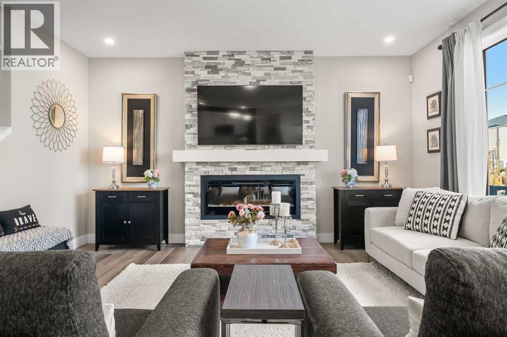 Upgraded electric fireplace with striking feature wall in the main living area