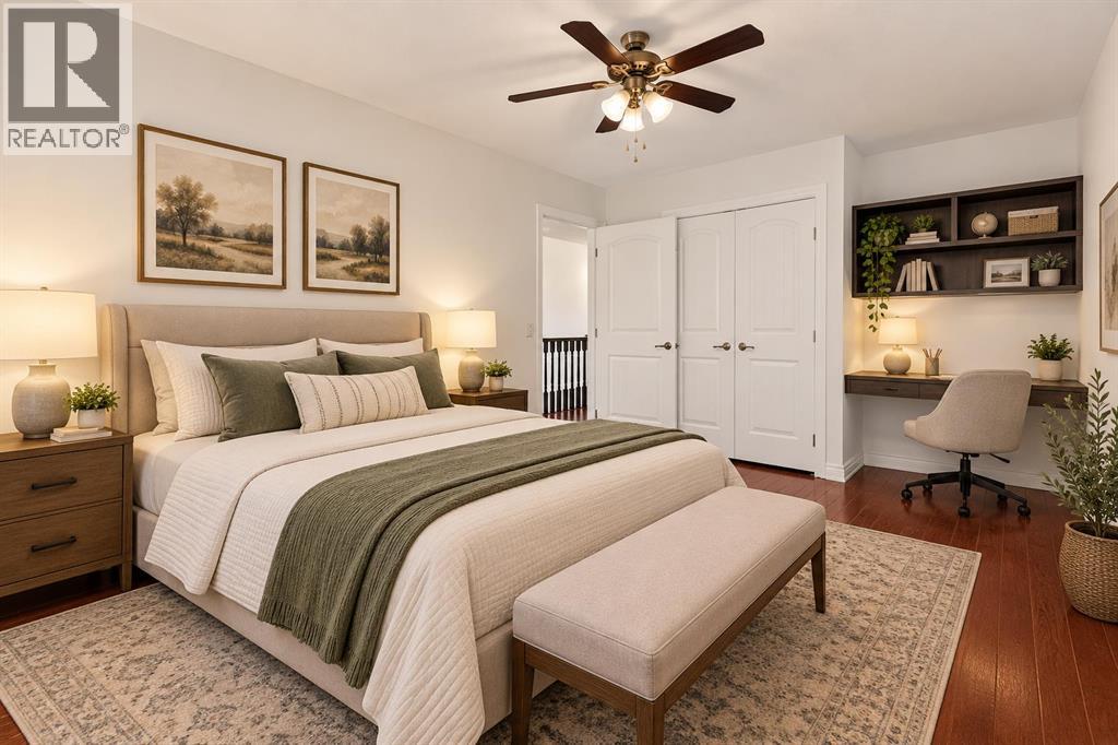 One of the upper level bedrooms (this photo has been digitally staged)