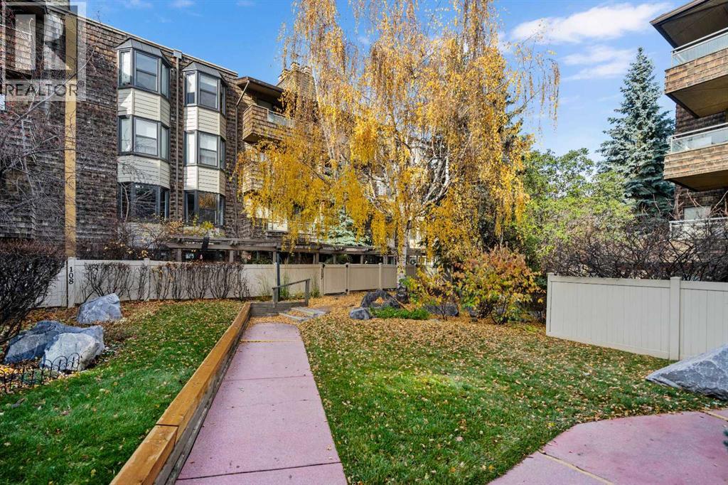 Lovely and well Maintained Gardens and Walkways at Back of Condo