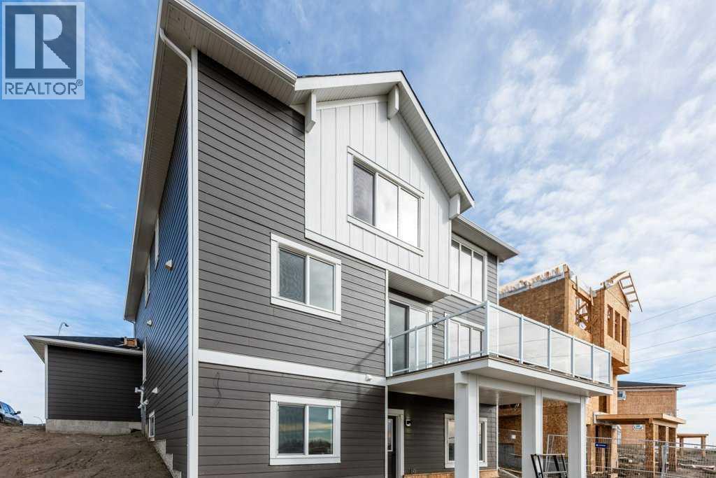 Back of the home with walk out basement