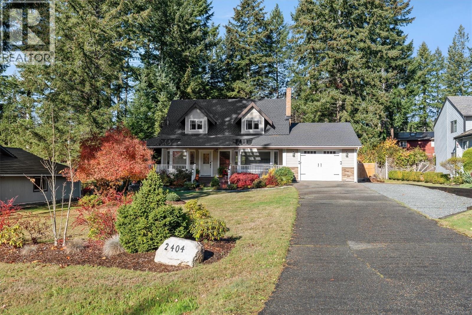 Front of the home and paved driveway