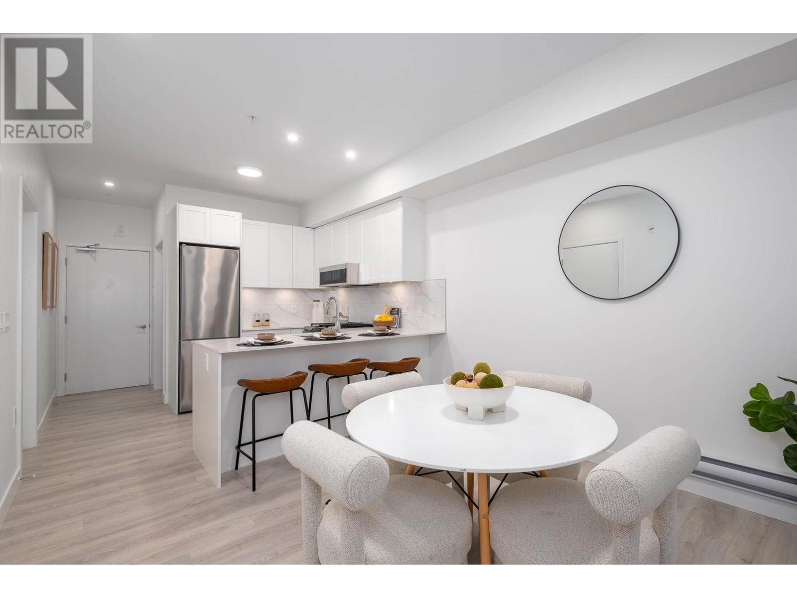 206 2688 Duke Street, Vancouver, British Columbia  V5R 4S9 - Photo 1 - R2827477