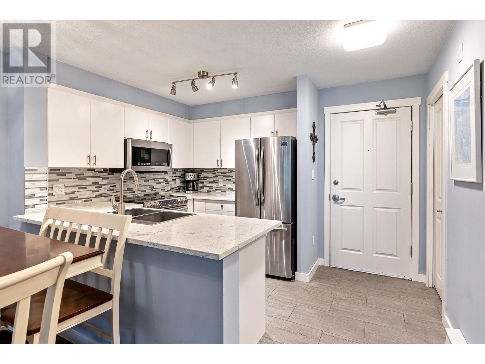 201 260 Newport Drive, Port Moody, British Columbia  V3H 5C6 - Photo 1 - R2864966