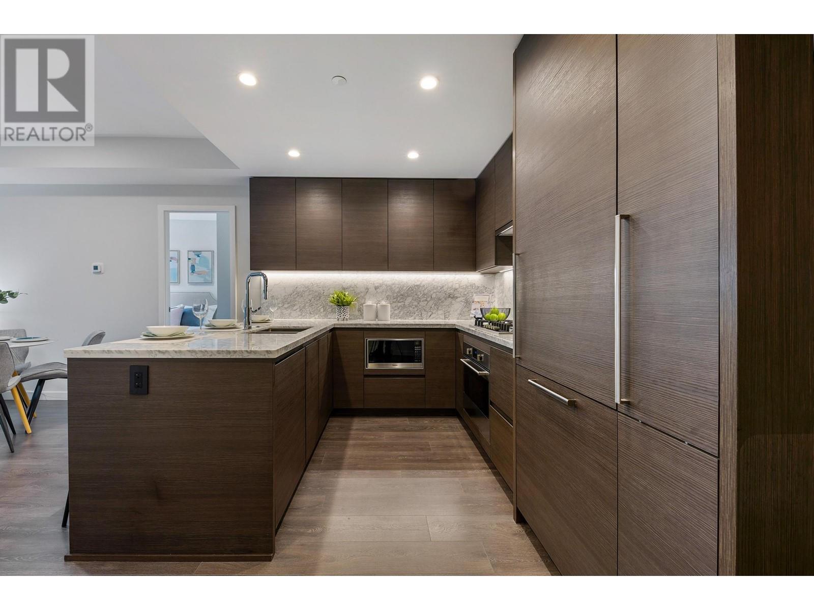 308 305 Morrissey Road, Port Moody, British Columbia  V3H 0M3 - Photo 2 - R2866937