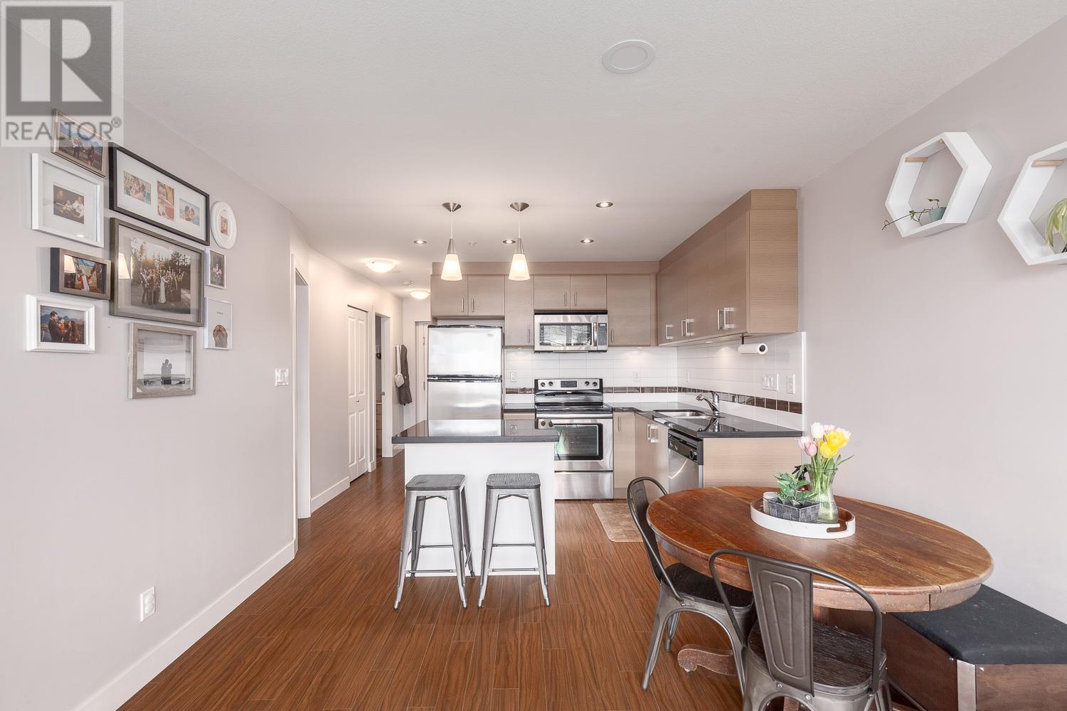204 12079 Harris Road, Pitt Meadows, British Columbia  V3Y 0C7 - Photo 2 - R2868726