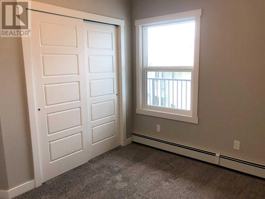 205, 499 Meadow Lake Court E, Brooks, Alberta T1R 0Y7 - Photo 7 - A2175160