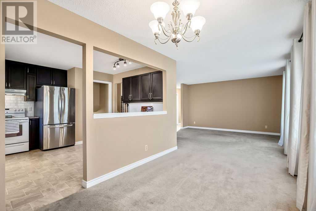 132 Beaconsfield Way Nw, Calgary, Alberta  T3K 1X1 - Photo 5 - A2170563