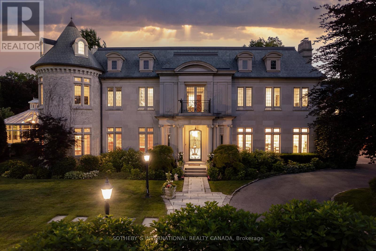 Arguably one of the most iconic estates in Toronto, this French-style chateau sits on a sprawling 3.12 acre, double lot in the prestigious enclave of Bayview Ridge. Designed by the famed Canadian architect Gordon Ridgely, this exquisite property is truly incomparable. The private grounds have an undeniable sense of European opulence with unobstructed West views of the Rosedale Golf Club, lavish gardens designed by Ron Holbrook, a negative-edge infinity pool, a reflecting pond with a stepped waterfall, stone gate entry to a circular drive, tennis court, flagstone terraces, and stone cabana. The exterior facade is just as remarkable as the property itself. Spanning nearly 150' wide and 100' deep, it is a combination of Indiana-buff limestone and rubble-stone cladding with Vermont unfaded green slate shingles, and lead-coated copper flashings, eaves, and downspouts. The asymmetrical shape is highlighted by the South wing: an awe-inspiring, two-story turret with crawling ivy, transom windows, and custom limestone trim. With over 15,000 square feet of living space, this 6+2 bed, 10 bath home was built to accommodate a large family, complete with a separate apartment for a live-in nanny or additional family members. The finishes inside this home are extraordinary with almost surgical precision and laser-like craftsmanship. The entire house features Brazilian cherry wood with African inlay hardwood floors, intricate crown moulding, acid-etched antique ""Crema Marfil"" marble floors, custom built-in millwork, solid North American cherry wood doors, crown moulding, Indiana limestone (around fireplaces), coffered ceilings, heated bathroom floors, and so much more. **** EXTRAS **** Over 15K Sq Ft Of Living Space, 6+2 Beds, 10 Baths, 10+ Parking, 7 Fireplaces, Bordeaux Inspired Wine Cellar, Tasting/Cigar Rm, Grand Dining Rm W/ Fire, Luxe Sauna, Two Pools, Tennis Crt, Reflecting Pond, Gym, Nanny Suite & Sunset View (id:48254)