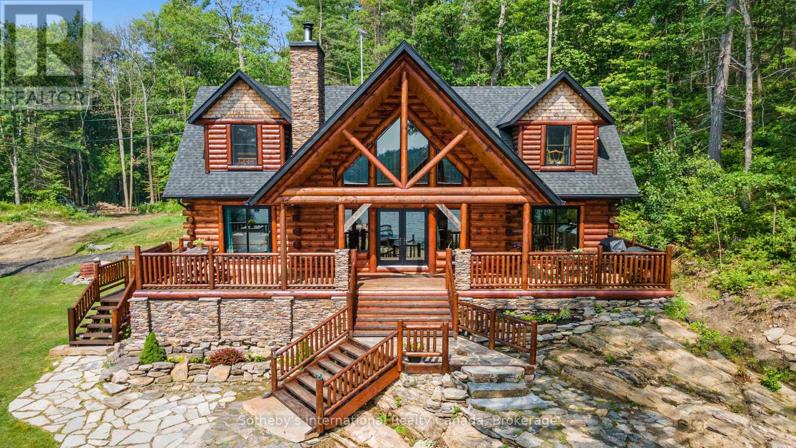 Welcome to your dream waterfront retreat in Crystal Bay on Go Home Lake! This stunning winterized Golden Eagle log home boasts 3 bedrooms, 3 bathrooms, and 2,642 square feet of luxurious living space. Step inside and be captivated by the beauty of the 10" white Wisconsin pine logs that frame the home. Accessed by boat, you are under 10 minutes from the marina. Enjoy the serene ambiance with 558 feet of water frontage, set on a spacious 1.56-acre lot. The southeast exposure fills the home with natural light, creating a warm and inviting atmosphere. The main floor features a stunning ledge rock fireplace in the spacious living room while the dining room offers ample seating for gatherings. The gourmet kitchen is a chef's delight, equipped with stainless steel appliances, a moveable island, granite countertops, and a beautiful stone backsplash. The spacious primary suite boasts a walk-out to the deck, complete with an ensuite that includes a jacuzzi tub, custom granite shower, and double sink. The attention to detail is evident with custom stonework throughout. Rounding out this level is a bathroom designed to resemble an outhouse, adding a unique touch to the home and a convenient stackable laundry pair. Upstairs, the loft area overlooks floor-to-ceiling windows, creating a cozy retreat. Here you will also find two generously sized bedrooms with vaulted ceilings and a 4-piece bath that provides comfortable accommodations for family and guests. This home is beautifully furnished throughout, showcasing quality furniture and log beds that perfectly complement the rustic charm. Outside, the tastefully landscaped property features a flagstone front yard, a tiki bar on the dock, and a sand beach area creating the ideal space for outdoor entertaining. Relax and enjoy the soothing sounds of your own personal waterfall.   The adjacent property is also for sale, offering the potential for a family compound, complete with a spacious 3 bedroom log home (see MLS # X12016866). (id:48254)
