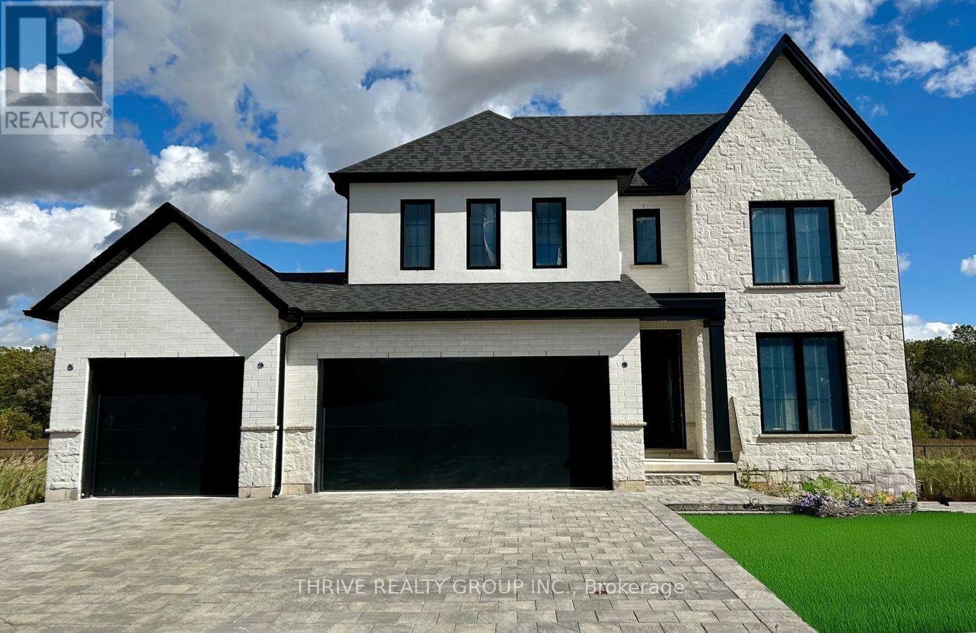 91 Aspen Circle Thames Centre, Ontario This brand-new 4-bedroom, 2.5-bathroom home by Sifton Properties offers 2,746 sq. ft. (-/+) of beautifully designed living space on a premium partial look-out lot backing onto green space. The stunning Shouldice brick and stone exterior is complemented by a custom 8 front door with a matte black grip-set and matte black house numbers, creating a sophisticated first impression. A third bay added to the garage provides extra parking or storage space, while 8 interior doors throughout the main floor enhance the home's open and airy feel. Additional 4 pot lights and rough-ins for under-cabinet lighting allow for a bright and modern atmosphere, while front exterior light fixtures add a stylish touch. Enjoy seamless indoor-outdoor living with 8 patio doors leading to the rear deck, perfect for entertaining or taking in the natural surroundings. As a Quick Closing Home, this property offers the ideal balance of convenience and customization, allowing you to personalize key finishes like flooring, cabinetry, and countertops. Located in Rosewood, Thorndale's premier new community, you'll appreciate the spacious lots, fresh open air, and easy access to schools, shopping, and recreation. Secure your spot in this growing neighbourhood today! Minimum 120-day closing required. (id:48254)