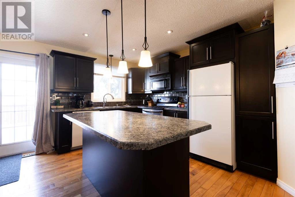 1031 Lakemount Boulevard S, Lethbridge, Alberta  T1K 3S6 - Photo 4 - A2195127