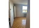 Spare room featuring light parquet floors