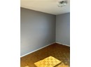 Spare room featuring parquet floors