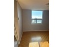 Unfurnished room with light parquet flooring