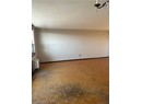 Spare room with radiator heating unit and a textured ceiling