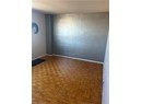 Unfurnished room with parquet flooring
