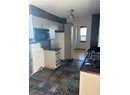 Kitchen with white cabinets, tasteful backsplash, and sink