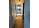 Corridor with light parquet floors