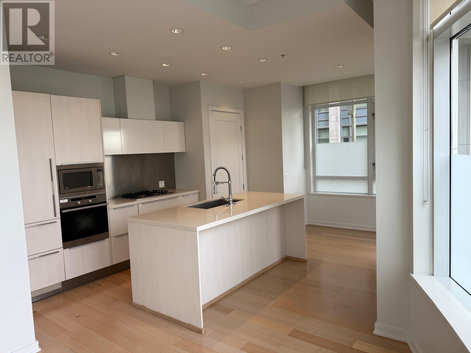 102 138 Athletes Way, Vancouver, British Columbia  V5Y 0B5 - Photo 1 - R2975712