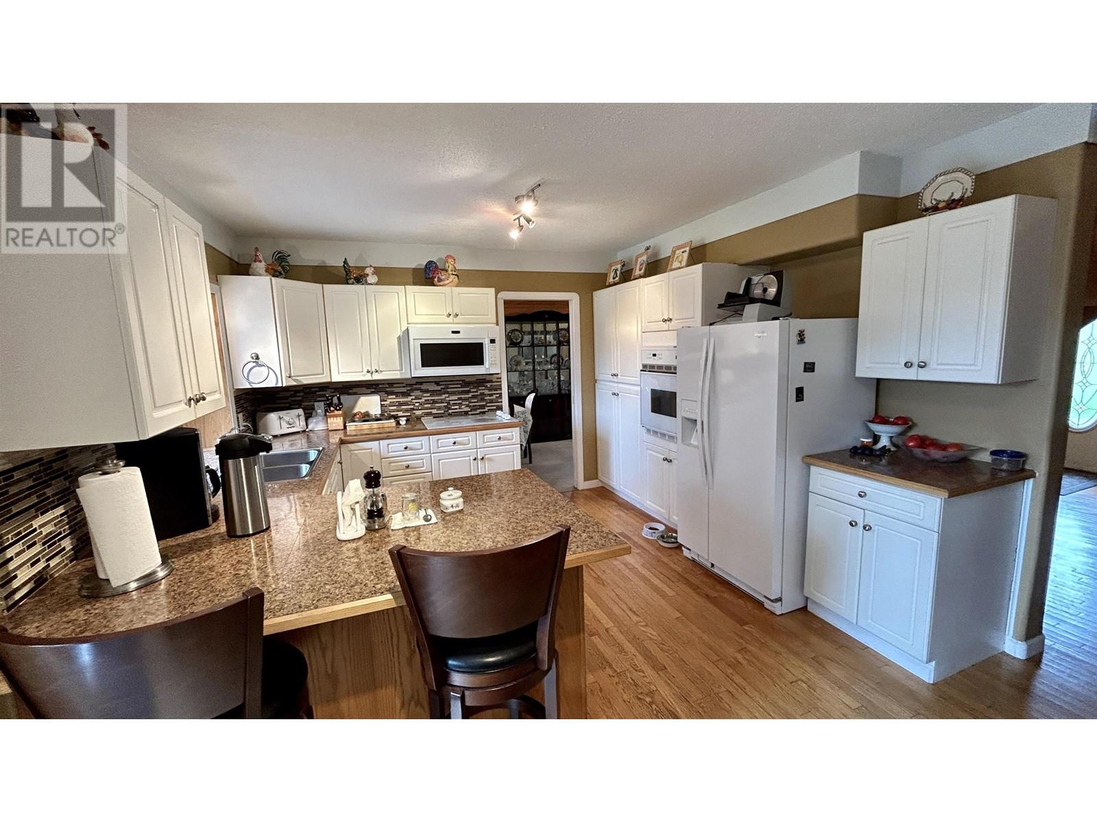 4906 Kitwanga Drive, 108 Mile Ranch, British Columbia  V0K 2Z0 - Photo 7 - R2976081