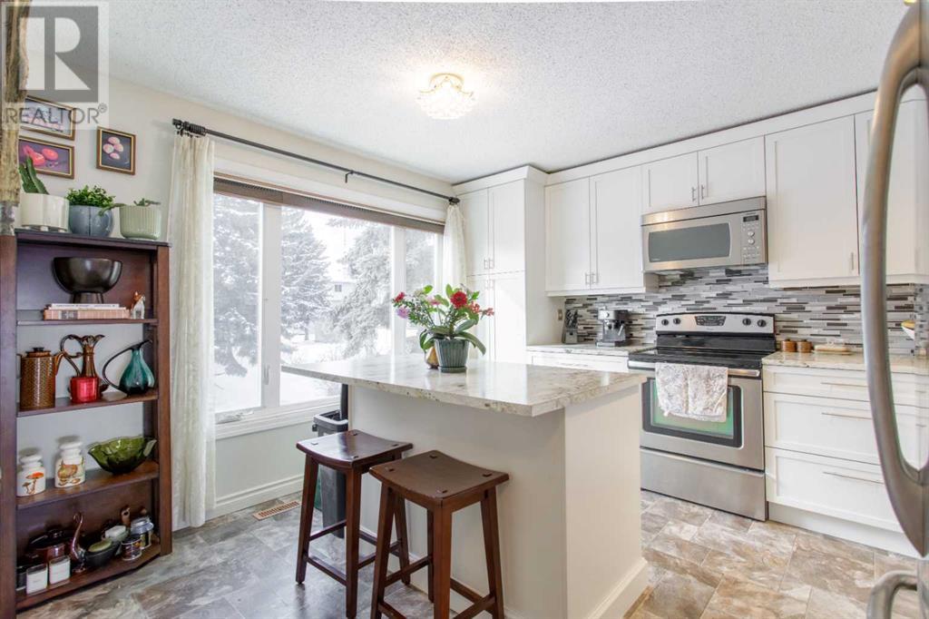 716 Queenston Terrace Se, Calgary, Alberta  T2J 6H6 - Photo 5 - A2195643