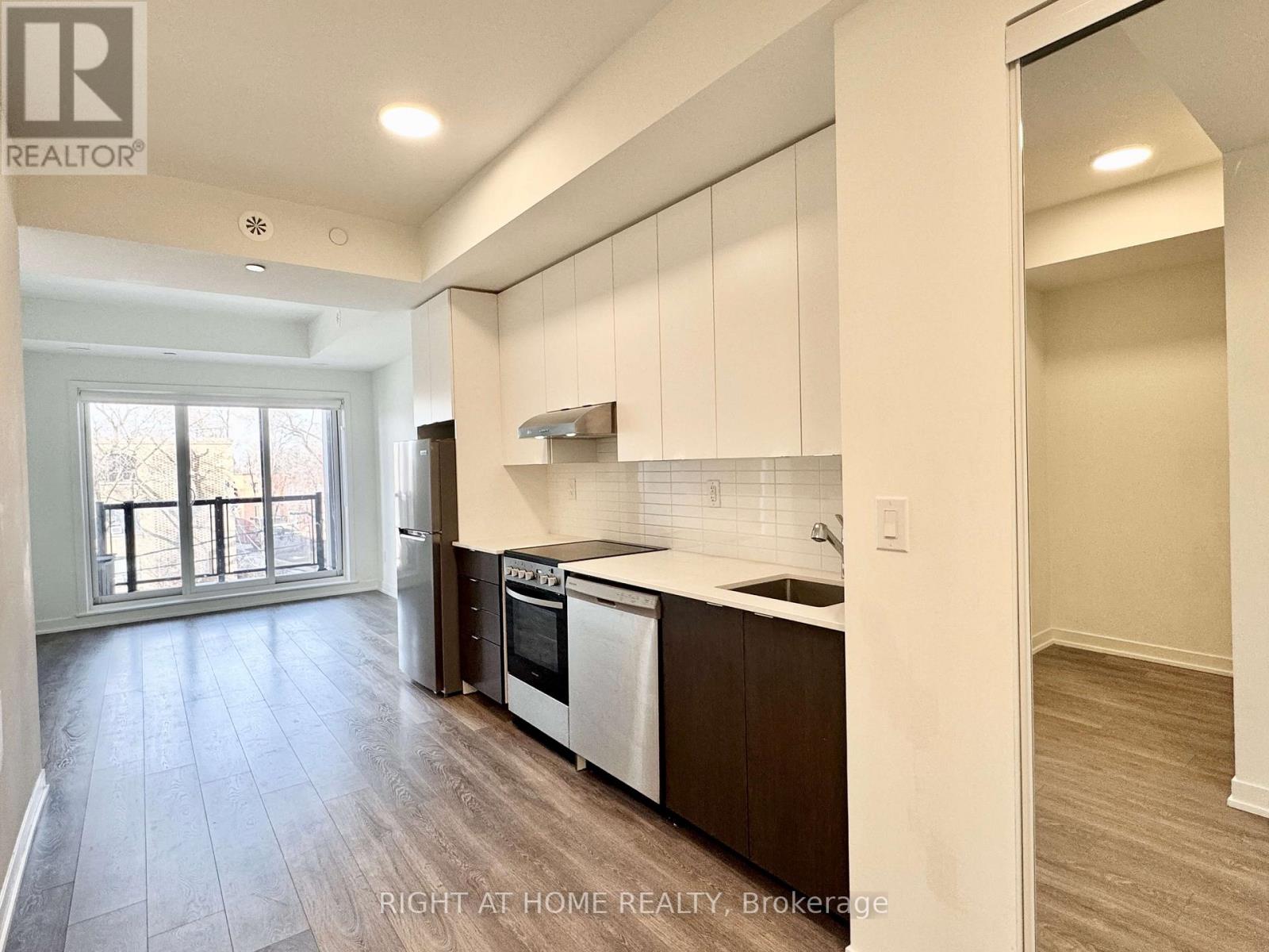 214 - 165 Canon Jackson Drive, Toronto, Ontario  M6M 0C4 - Photo 2 - W12018613