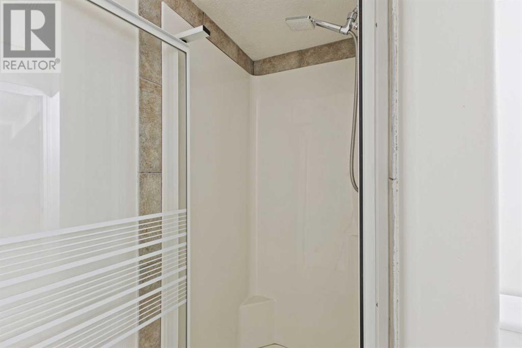 321 Crystal Shores View, Okotoks, Alberta  T1S 2H9 - Photo 25 - A2187474
