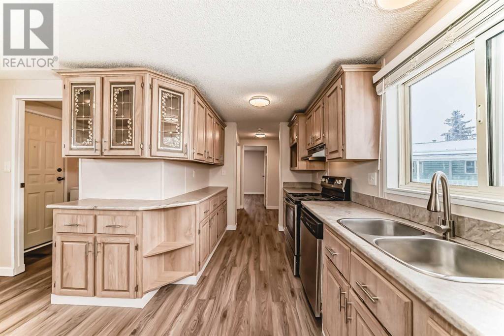 203 Burroughs Circle Ne, Calgary, Alberta  T1Y 6K8 - Photo 2 - A2194680