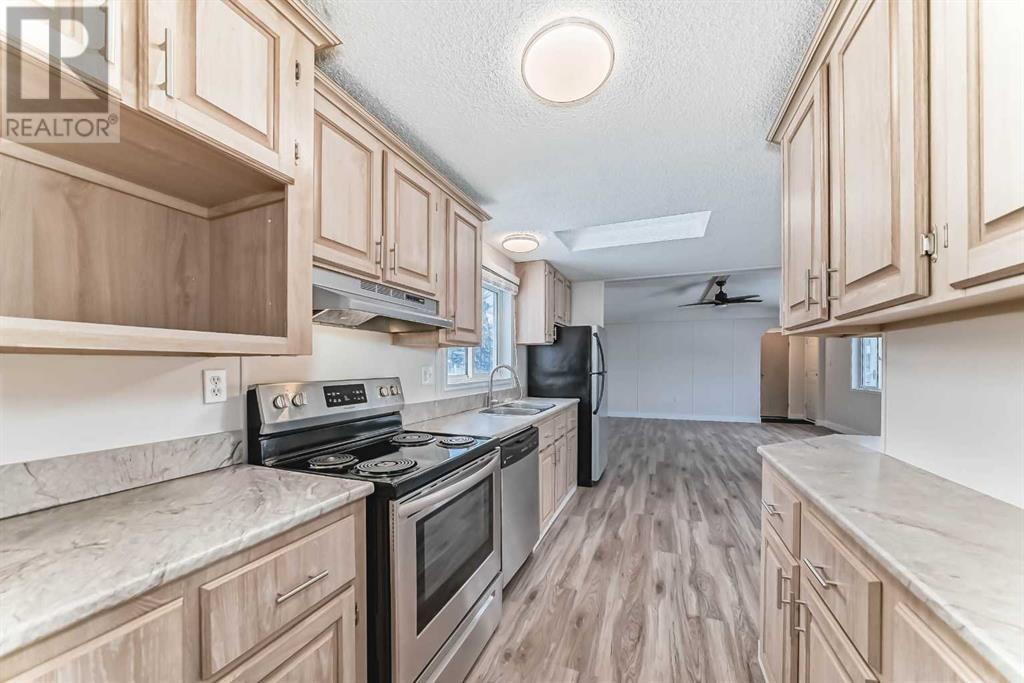 203 Burroughs Circle Ne, Calgary, Alberta  T1Y 6K8 - Photo 4 - A2194680