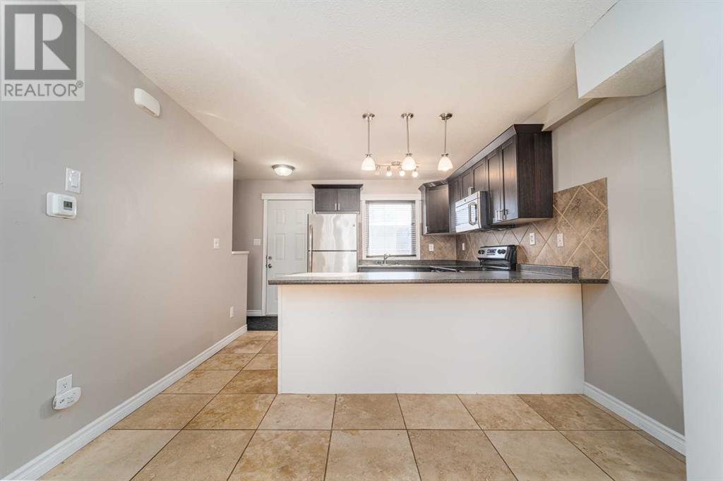 1415 Lakemount Boulevard S, Lethbridge, Alberta  T1K 3K3 - Photo 11 - A2196285