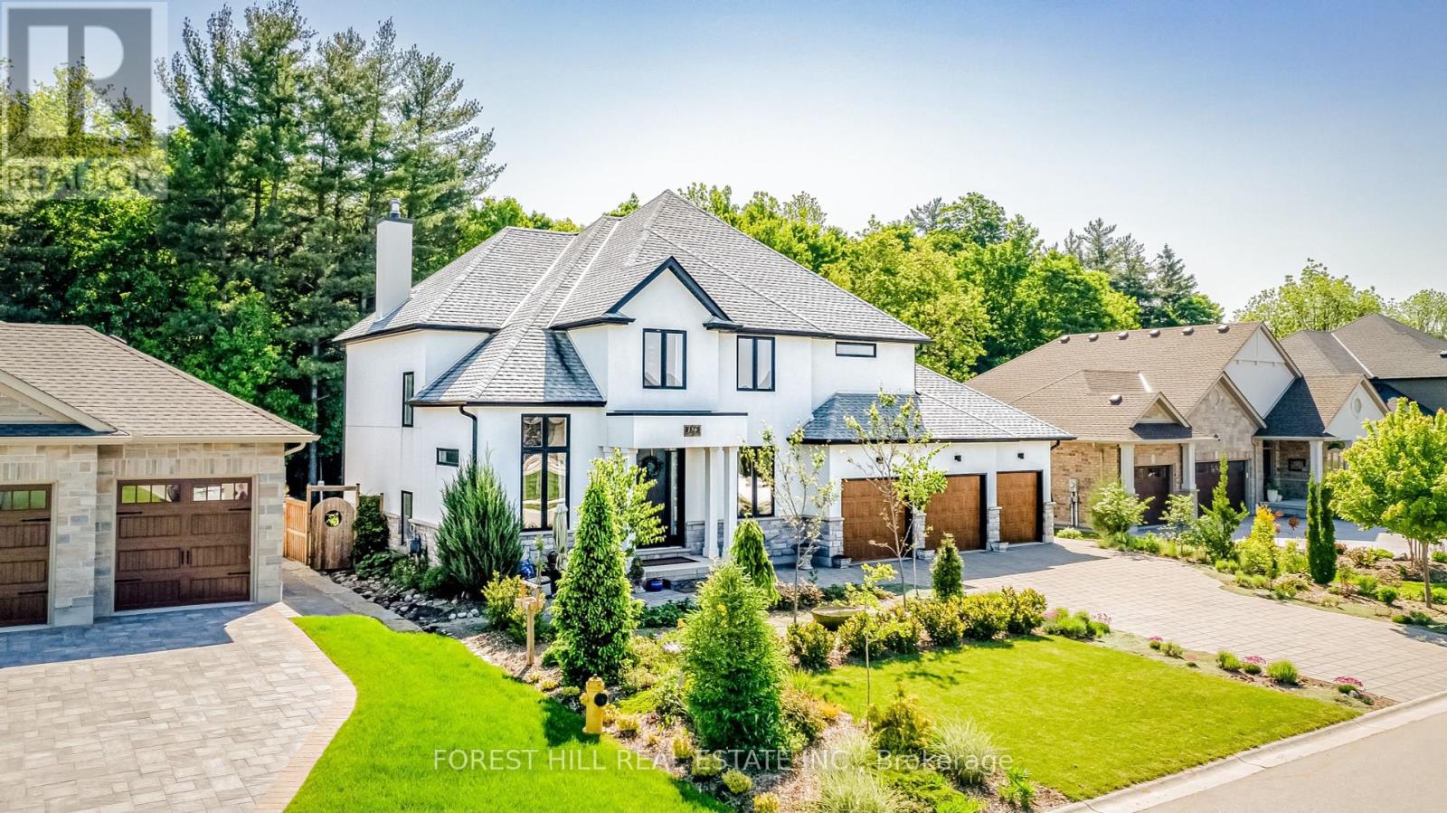 One-of-a-kind property, architecturally designed with clean lines, warm wood accents and premium classic contemporary finishes, this magnificent custom built home, offers a unique and serene living experience. The open floor plan seamlessly integrates indoor and outdoor living. Nestled amidst a lush forest, this property features a stunning pool, hot tub and a backyard brimming with fruit trees and berries of every kind.Expansive windows throughout the house provide breathtaking views of the surrounding forest and flood the interior with natural light. Spacious and airy, the living room features a cozy wood burning fireplace. The gourmet kitchen complete with butler's pantry, is equipped with high-end stainless steel appliances, quartz countertops, and a large island perfect for gatherings. A dedicated home office space provides a quiet and inspiring environment for remote work. All bedrooms in this home have their own bathroom! The primary suite is a true retreat with a walk-through closet leading to a spa-like ensuite bathroom with heated floors. Fully finished basement with an additional bedroom and a 3-sided gas fireplace. *Outdoor Oasis* The backyard is a horticultural haven with every imaginable fruit tree and berry bush. The sparkling pool and hot tub are perfect for relaxation and entertaining, set against the backdrop of the tranquil forest. *Forest Views* Enjoy the serenity of nature from every angle. The property is surrounded by mature trees, offering privacy and a peaceful atmosphere. Ample parking space with a three-car garage and additional driveway space for guests.Built by Dick Masse Homes Ltd.. Don't miss the opportunity to make this one-of-a-kind property your own.. Schedule a viewing today and experience the perfect blend of elegance, comfort, and natural beauty. (id:48254)
