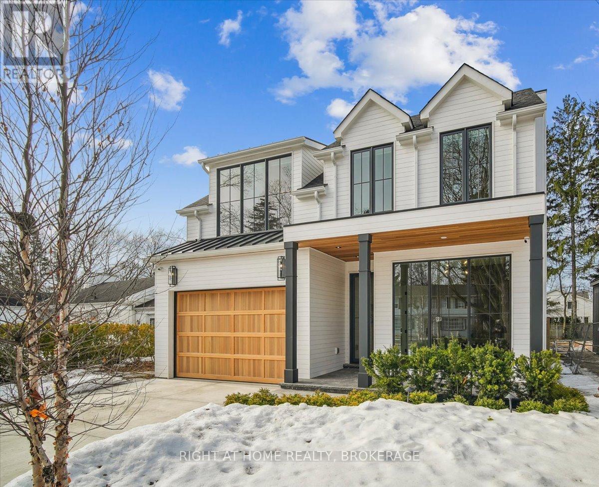Situated mere minutes from downtown Oakville in the esteemed southeast neighborhood, this exquisite custom-built residence, completed in 2024, showcases an elegant blend of design, functionality, and comfort. The property features a west-facing rear garden that benefits from abundant sunlight throughout the day and a private, mature landscape adorned with natural trees. 212 Watson Avenue emanates a bright and airy atmosphere, accentuated by expansive 10-foot ceilings across all levels, white oak hardwood flooring, and full-length windows that seamlessly connect the interior with the exterior. Encompassing over 4,500 square feet of living space, alongside a gourmet outdoor kitchen, this property is ideally suited for people who appreciate entertaining both indoors and outdoors. The open-concept family room and chefs kitchen facilitate shared culinary experiences, featuring Wolf and Sub-Zero appliances. There exists ample flexibility for dining, whether at the oversized island, breakfast nook, formal dining room, or the outdoor kitchen, providing a multitude of options. For recreational enjoyment, the  lower level serves as an inviting escape, complete with facilities for workouts, movie nights on the 150-inch theater-style projection screen, or friendly gatherings at the bar. When it is time to retire for the evening, the primary suite occupies the rear of the residence, offering scenic views of the garden. Residents can unwind in a spa-inspired bathroom equipped with a soaking tub, steam shower, dual sinks, and oversized mirrors. A generously sized custom walk-in closet ensures ample space for personal belongings. Practicality has been prioritized, with an office conveniently located near the front entrance, a mudroom adjacent to the garage, and a laundry situated on upper level. Ultimately, this home  incorporates double furnaces and AC units, along with heated floors in all bathrooms and the basement, ensuring a pleasant environment throughout all seasons. (id:48254)