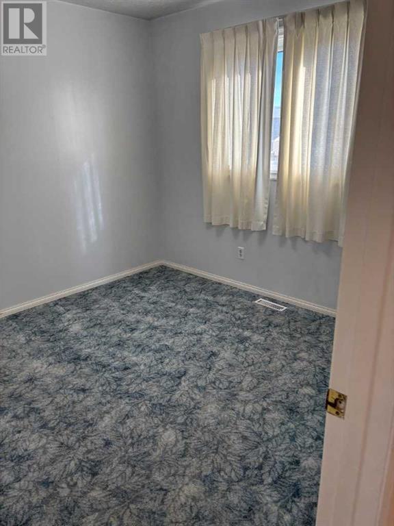824 Rundleside Drive Ne, Calgary, Alberta  T1Y 1E7 - Photo 3 - A2199498