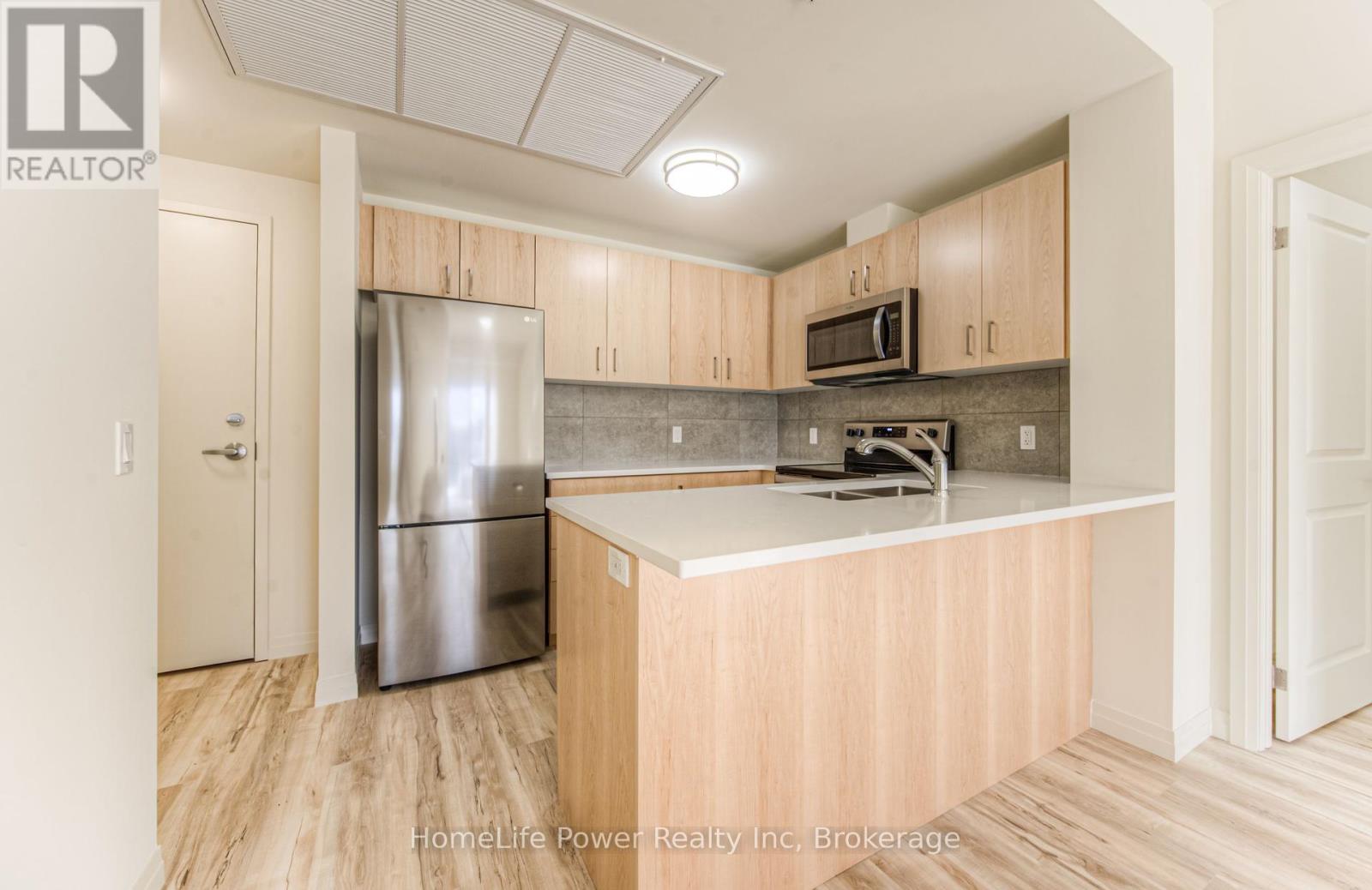 203 - 301 Westmount Road, Kitchener, Ontario  N2M 5M9 - Photo 14 - X12053486