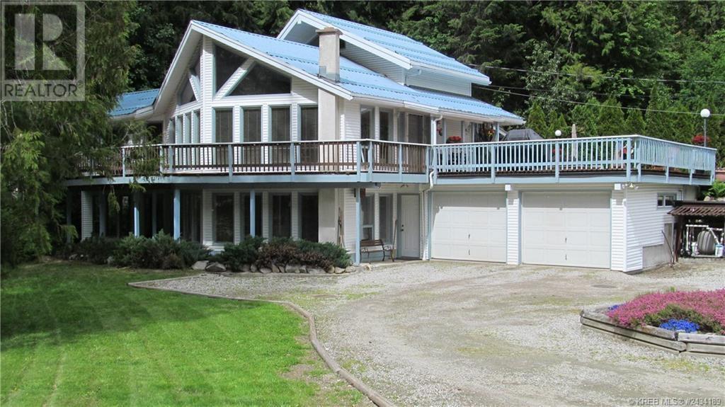 Kootenay Lifestyle + Income Potential—Minutes from Nelson Set on 5 unzoned acres just south of Nelson City Limits, this unique property offers the ultimate live-work-play setup—with four rental units, a beautiful main home, and exciting potential as a mountain bike or ski accommodation. The spacious 3-bed, 3-bath home is bright and modern, with an office, family room, and plenty of space for guests. Step outside to a heated pool, hot tub, and room to unwind after big adventure days. Four rentals—including a duplexed cabin—generate steady income, while a detached workshop and ample parking support gear, guests, or business plans. With world-class biking and skiing nearby, this is the perfect base for a lifestyle business, retreat, or personal playground. No zoning. Endless options. Build the life you’ve imagined. Book your showing today. (id:48254)