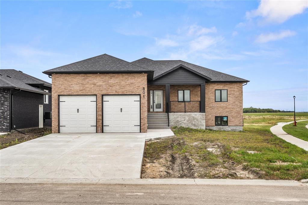 801 Turnberry Cove Niverville, Manitoba R07//Niverville/Welcome to the Highlands in Niverville! Huge Price improvement!! Front landscaping included. This beautiful 1680 sq ft bungalow is newly built and features many upgrades. Its open layout and 9 ceilings really accentuates this home s spacious layout. The kitchen includes brand new stainless steel appliances, quartz countertops, pot lights and island. It overlooks the bright dining and family rooms with large window highlighting the lake view backyard. The primary bedroom is large and features a 3 pc ensuite with glass door walk in shower, and walk in closet. Two more good sized bedrooms are also found on main floor as well as a 4pc main bathroom. The oversized double attached garage is fully insulated and drywalled has 13 ceiling and extra height on the double doors. The full basement awaits your finishing touches. Large corner lot, ICF foundation, built on piles, central air, Stone front exterior, and more! Never been lived in, come take a look! (id:48254)