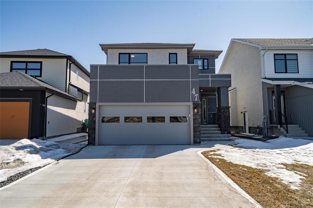 47 Lloyd Mckinnon Way Winnipeg, Manitoba 2K//Winnipeg/Welcome to your dream home! This stunning 1,831 sq ft two-storey home perfectly blends modern style & functional design. Featuring 3 spacious bedrooms & 3 bathrooms, this home offers plenty of room for families.Step inside to a spacious front foyer that sets the tone for the home. Inside, you'll find luxury vinyl plank flooring, quartz countertops, & a bright, open-concept layout filled w/ tons of natural light. The walk-in pantry flows into a stylish kitchen that opens to the living room, featuring a stunning fireplace feature wall & dramatic two-storey ceiling that makes the space feel open & bright perfect for entertaining.The main floor powder room is a thoughtful touch for guests, while upstairs you'll find a convenient laundry room, two well-sized secondary bedrooms, & a gorgeous primary suite w/ a walk-in closet & private ensuite.The fully insulated basement offers potential add an extra bedroom, bathroom, or rec room. Plus, enjoy the double attached garage for vehicles & storage. Outside, you'll love the extra-wide driveway, landscaped yard, deck to host summer bbqs, & curb appeal that stands out.Don t miss your chance to own this move-in ready home built for modern living! (id:48254)