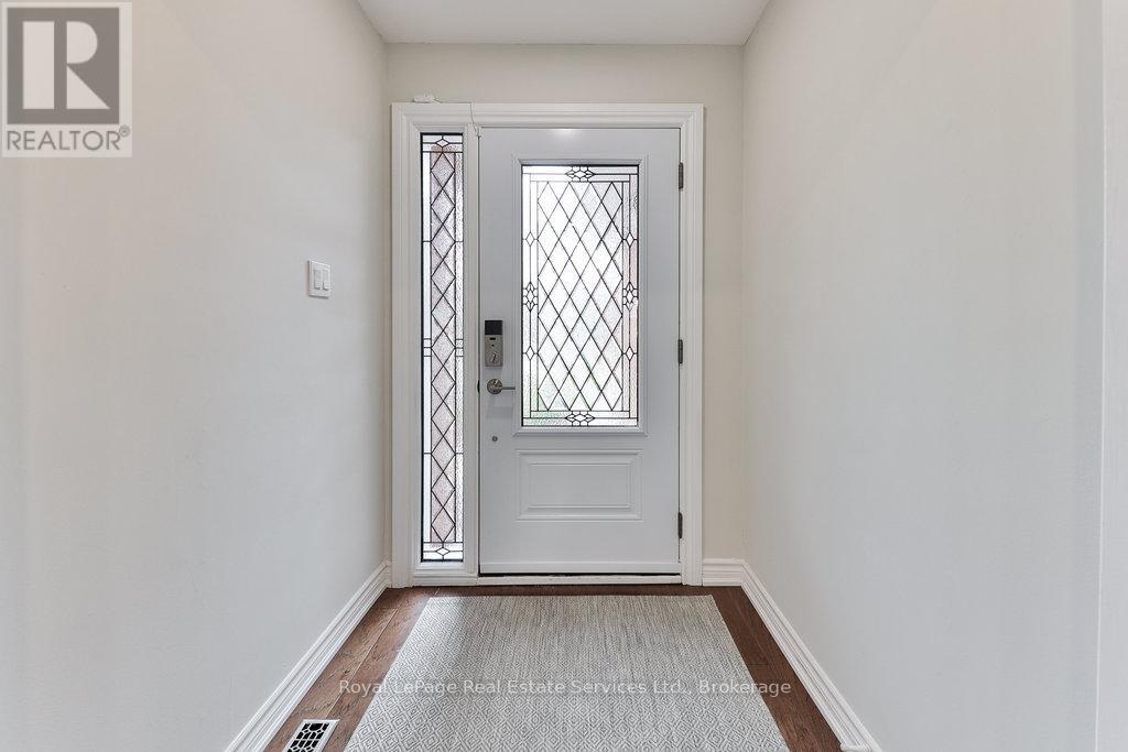1531 Stoneybrook Trail, Oakville, Ontario  L6M 2R4 - Photo 3 - W12078393