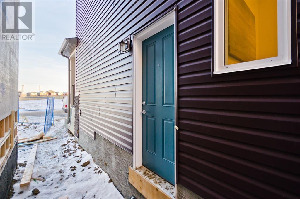 60 Buffaloberry Manor, Calgary, Alberta  T3M 3M1 - Photo 3 - A2210289